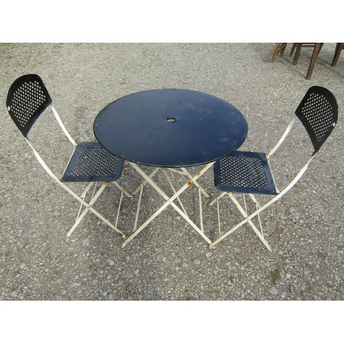 82 - A painted folding steel three piece Bistro set with lattice detail, the table 77cm diameter (af)