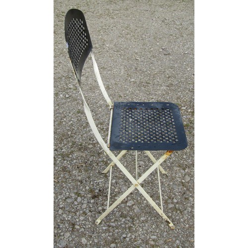 82 - A painted folding steel three piece Bistro set with lattice detail, the table 77cm diameter (af)