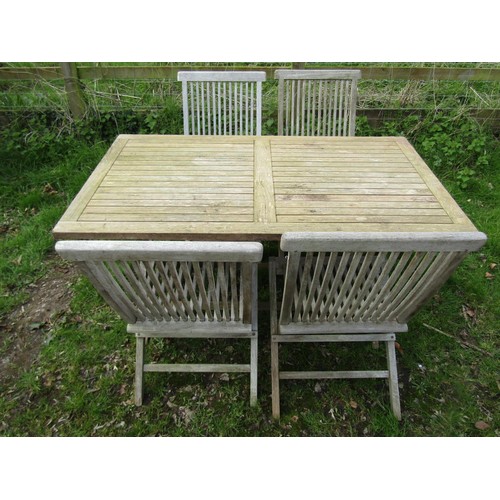 60 - A Bramblecrest weathered teak folding garden table with rectangular slatted panelled top raised on x... 