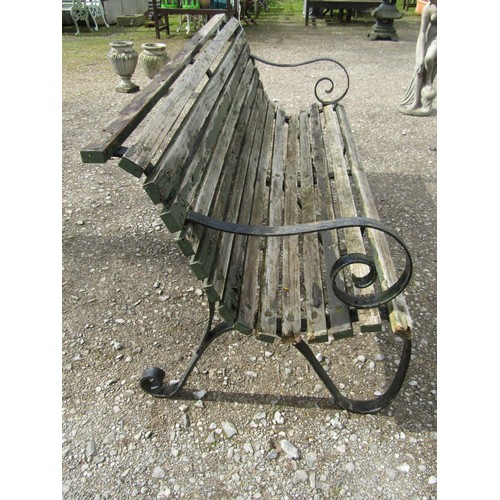 62 - A heavy gauge park/garden bench  with weathered teak slatted seat raised on heavy gauge sprung steel... 