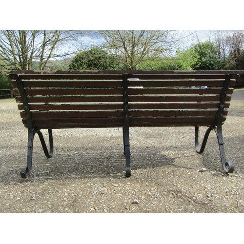 62 - A heavy gauge park/garden bench  with weathered teak slatted seat raised on heavy gauge sprung steel... 