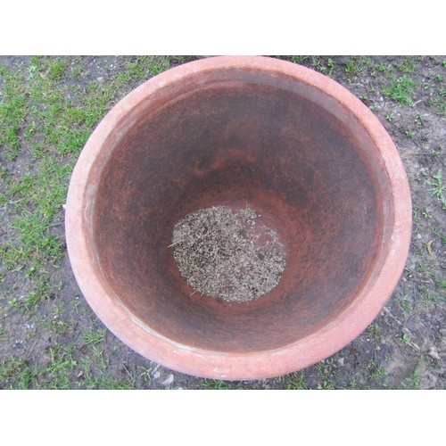 65 - A pair of large weathered terracotta planters of circular tapered and simple ribbed form, 56 cm high... 