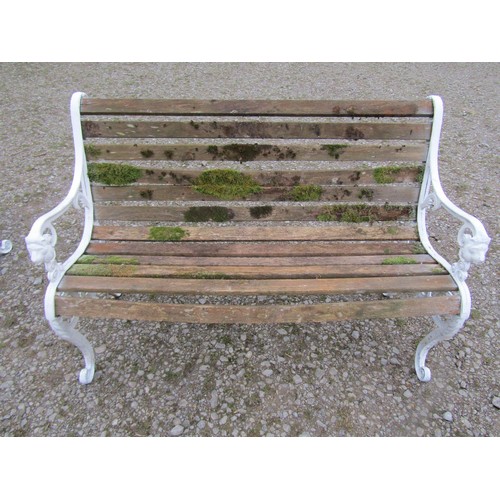 66 - A four piece garden suite comprising two seat bench and a pair of matching armchairs with weathered ... 