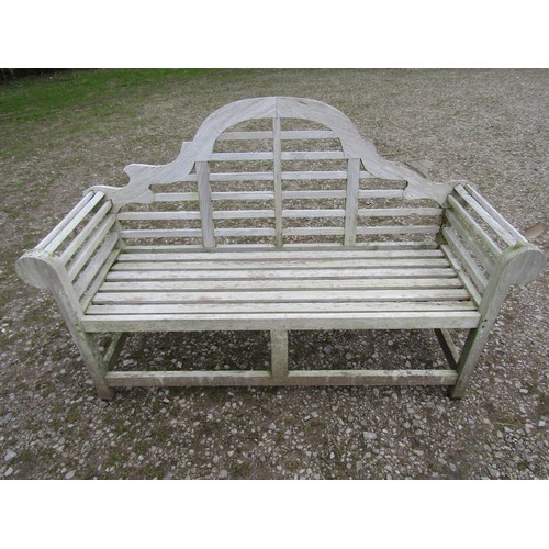 86 - A weathered teakwood Lutyens style three seat garden bench, 167cm wide