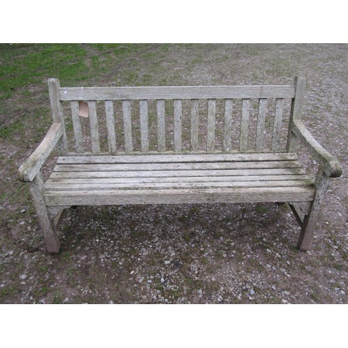 87 - A weathered teak Tiger Trading three seat traditional garden bench with slatted seat and back, 153cm... 