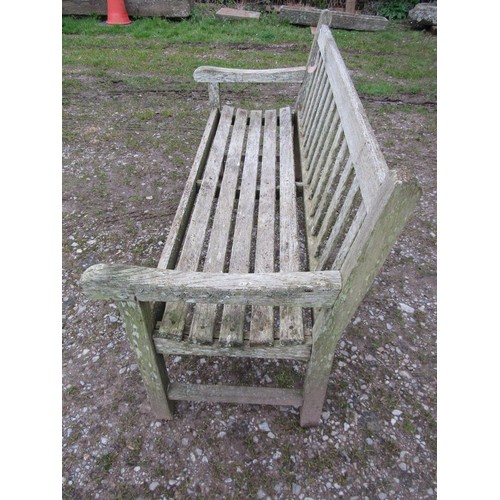 87 - A weathered teak Tiger Trading three seat traditional garden bench with slatted seat and back, 153cm... 