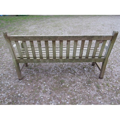 87 - A weathered teak Tiger Trading three seat traditional garden bench with slatted seat and back, 153cm... 