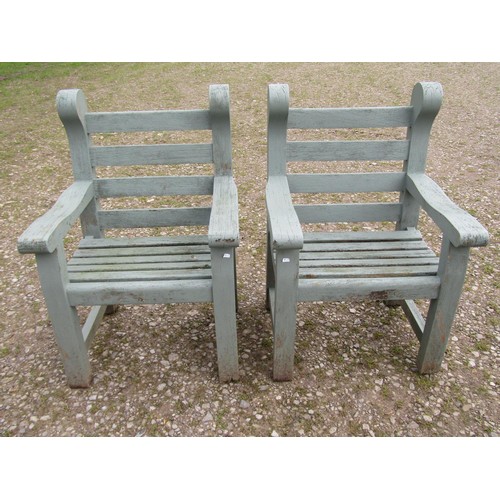 89 - A pair of Woodfern heavy gauge painted and weathered teak garden open armchairs with slatted seats a... 