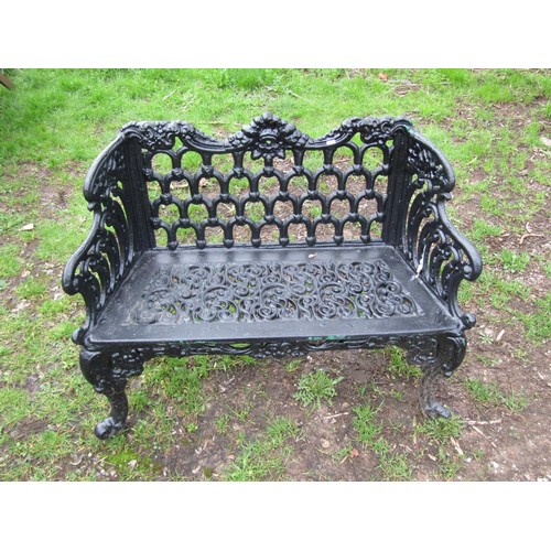 90 - A good quality heavy gauge cast iron two seat garden bench with shaped outline and decorative pierce... 