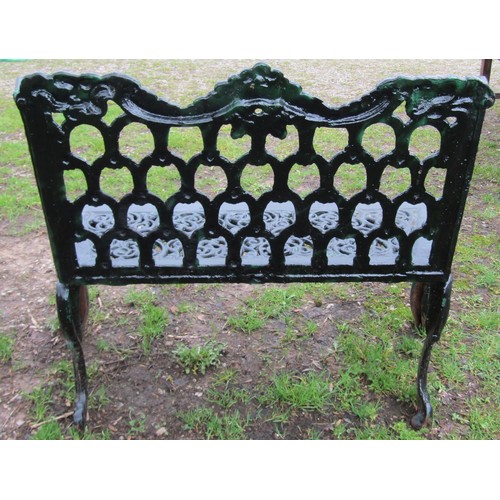 90 - A good quality heavy gauge cast iron two seat garden bench with shaped outline and decorative pierce... 