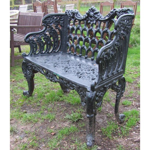 90 - A good quality heavy gauge cast iron two seat garden bench with shaped outline and decorative pierce... 