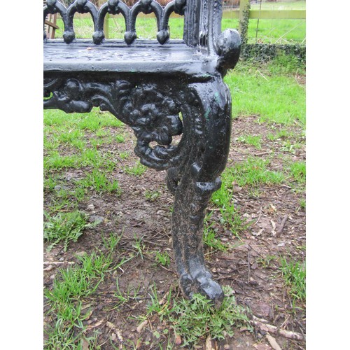 90 - A good quality heavy gauge cast iron two seat garden bench with shaped outline and decorative pierce... 