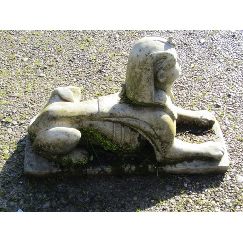 68 - A weathered cast composition Sphinx terrace/pier ornament 50 cm high x 74 cm long x 29 cm wide