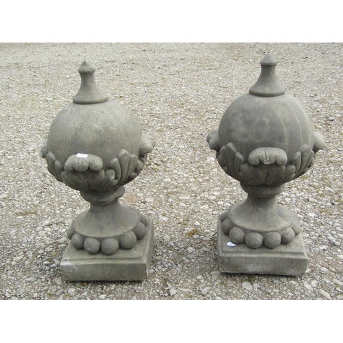 A pair of cast composition stone pointed sphere pier cap finials with acanthus detail 53 cm high