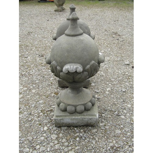 71 - A pair of cast composition stone pointed sphere pier cap finials with acanthus detail 53 cm high