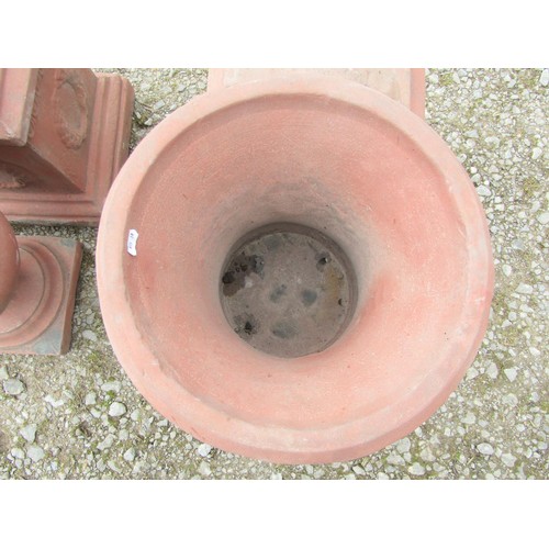 72 - A pair of faux terracotta cast composition stone trumpet shaped garden urns with repeating leaf patt... 