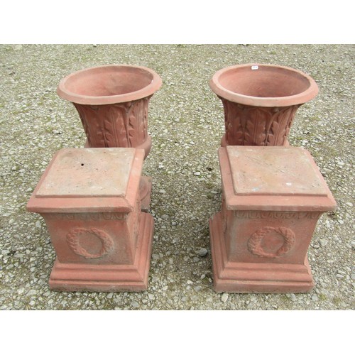 72 - A pair of faux terracotta cast composition stone trumpet shaped garden urns with repeating leaf patt... 