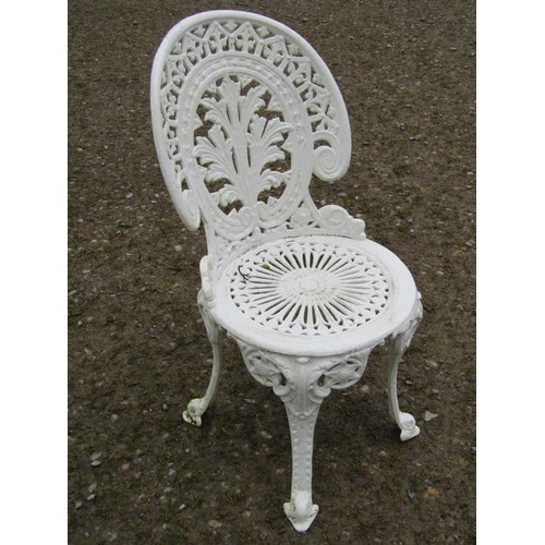 94 - A small cream painted cast alloy garden terrace table with decorative pierced repeating scrolling fo... 