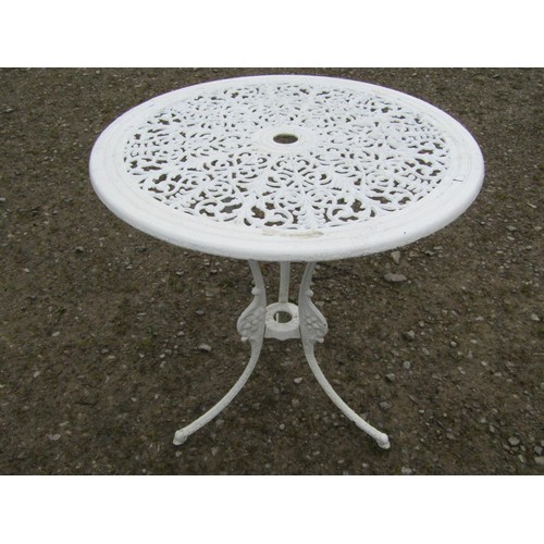 94 - A small cream painted cast alloy garden terrace table with decorative pierced repeating scrolling fo... 