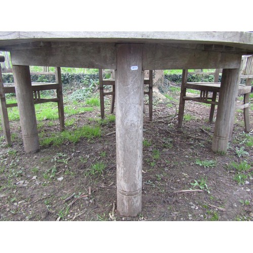 99 - A good quality large weathered (silvered teak) circular garden table with slatted panelled top and r... 