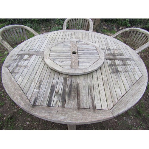 99 - A good quality large weathered (silvered teak) circular garden table with slatted panelled top and r... 