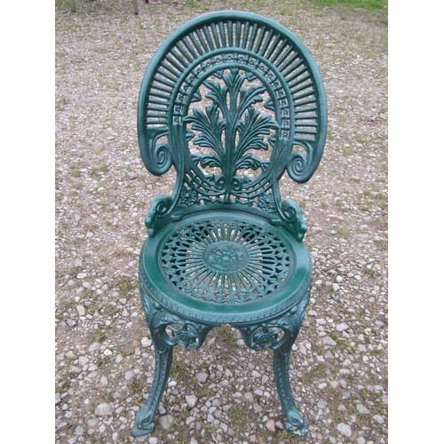 100 - A green painted cast aluminium garden terrace table of circular form, with decorative pierced top, t... 