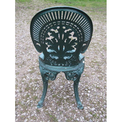 100 - A green painted cast aluminium garden terrace table of circular form, with decorative pierced top, t... 