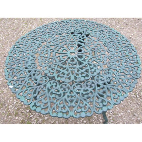 101 - A green painted cast alloy circular two tier garden terrace table, with decorative repeating 'c' scr... 