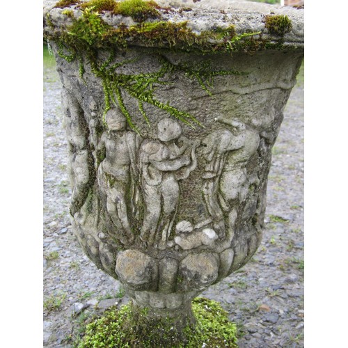 108 - A pair of weathered cast composition stone urns with flared rims and lobed bodies, and mythical proc... 