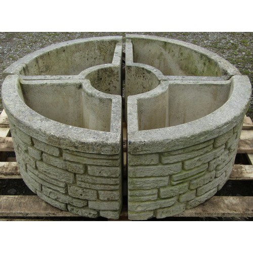 113 - A Sandford cast composition stone four sectional mock stock wall effect planter forming a circle, 90... 