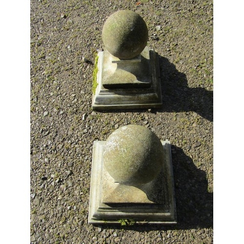 116 - A pair of cast composition stone three sectional pier caps with ball finials, approx 20 cm diameter,... 