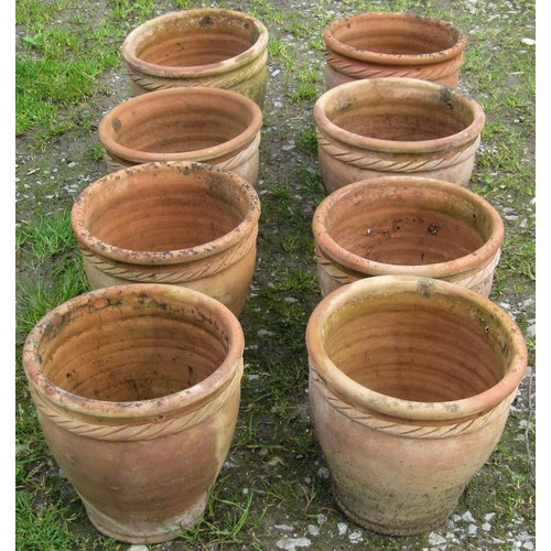 117 - Eight small weathered squat oviform terracotta planters with rope twist collars, 23 cm high x 24 cm ... 