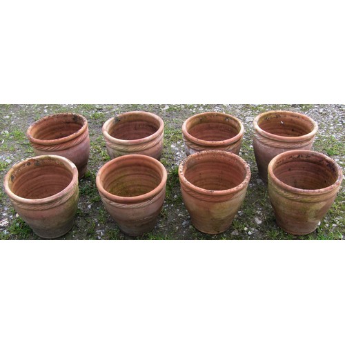 117 - Eight small weathered squat oviform terracotta planters with rope twist collars, 23 cm high x 24 cm ... 