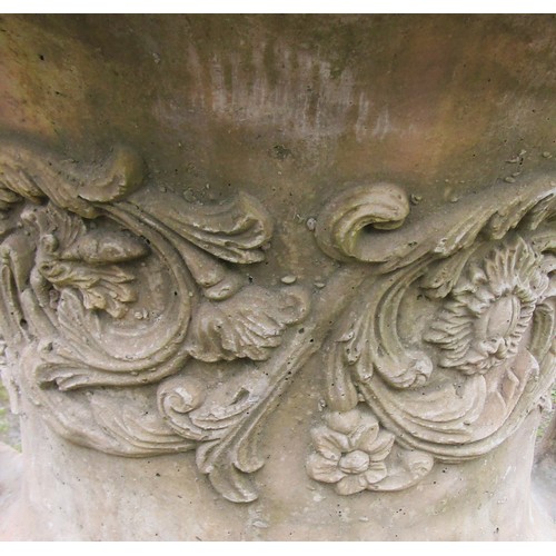 130 - A large cast composition stone campana shaped garden urn with repeating scrolling foliate relief det... 