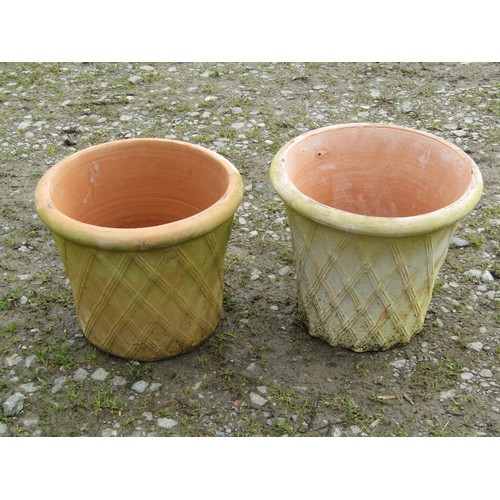 141 - A pair of contemporary terracotta planters in the form of lattice baskets, 27 cm high x 32 cm diamet... 