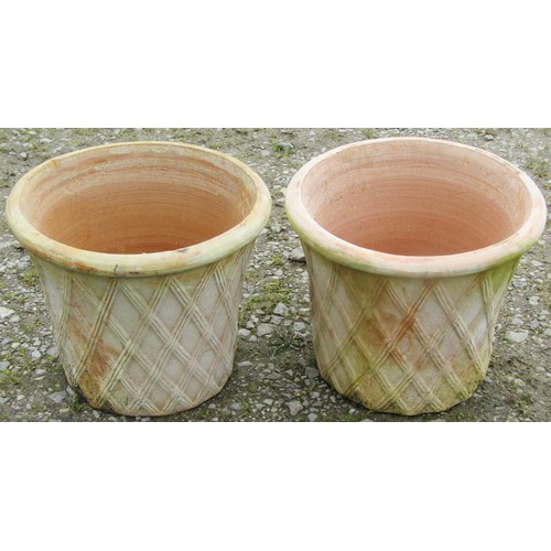 145 - A pair of contemporary terracotta planters in the form of lattice baskets, 32 cm high x 40 cm diamet... 