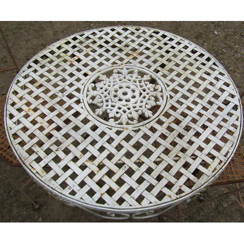 148 - A painted and weathered steel folding garden terrace table of circular form with circular lattice an... 