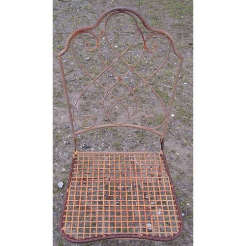 148 - A painted and weathered steel folding garden terrace table of circular form with circular lattice an... 