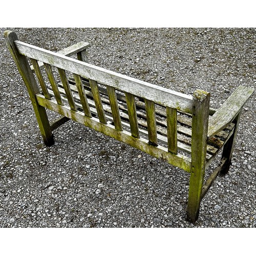 157 - A weathered two seat garden bench with slatted seat and back (unmarked) but possibly a Lister exampl... 