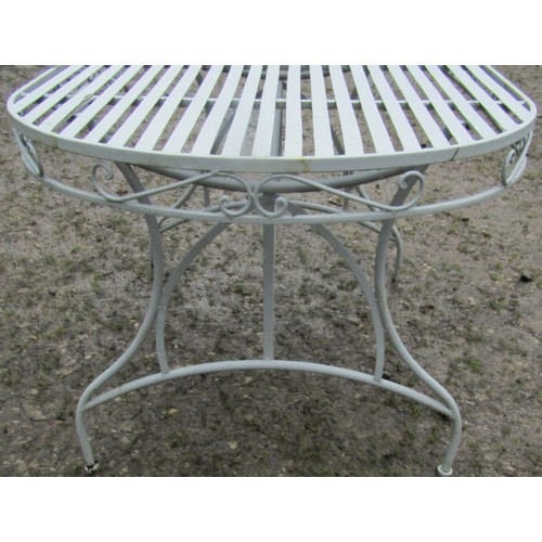 166 - A light blue grey seven piece garden terrace set comprising table of oval form with strap work top 1... 