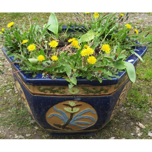 170 - A predominantly blue glazed hexagonal Chinese style glazed planter with foliate relief panels 37 cm ... 