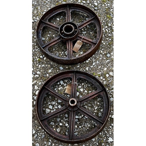 112 - A pair of vintage cast iron implement wheels stamped with numbers 9340, 44 cm diameter