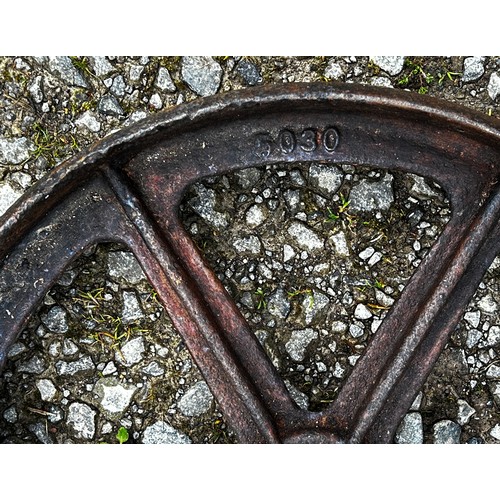 112 - A pair of vintage cast iron implement wheels stamped with numbers 9340, 44 cm diameter