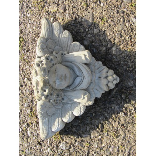 219 - Three small contemporary cast composition stone winged cherub garden ornaments including wall pocket... 