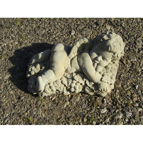 219 - Three small contemporary cast composition stone winged cherub garden ornaments including wall pocket... 