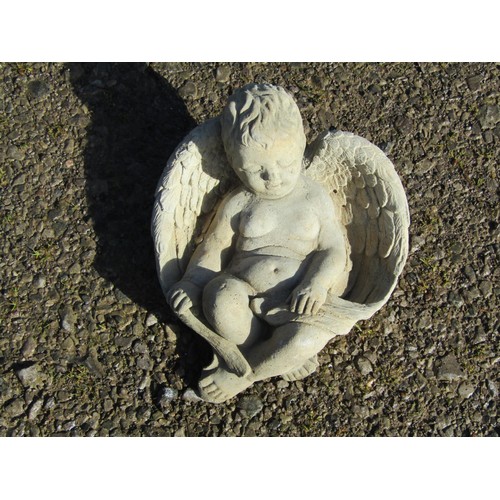 219 - Three small contemporary cast composition stone winged cherub garden ornaments including wall pocket... 