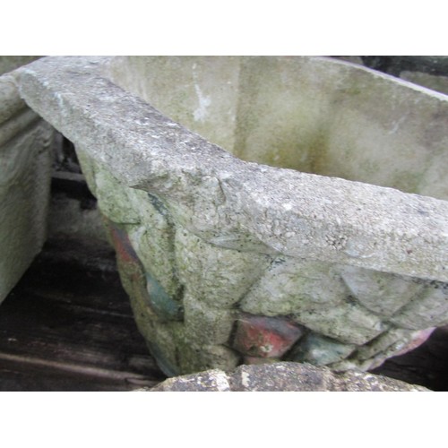 205 - A collection of cast composition stone planters, various designs and sizes, together with two shallo... 