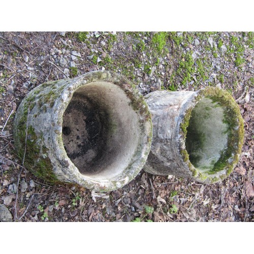 198 - A pair of weathered cast composition stone squat cylindrical planters with repeating classical winge... 