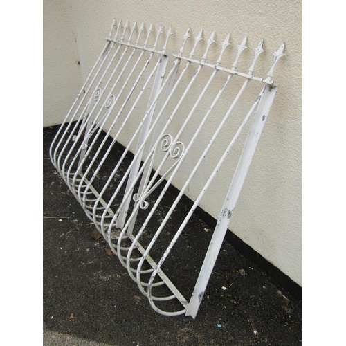 256 - Two cream painted steel balcony rails with simple open scroll work detail and spear head finials, ma... 