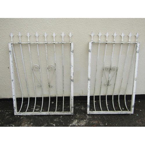 256 - Two cream painted steel balcony rails with simple open scroll work detail and spear head finials, ma... 